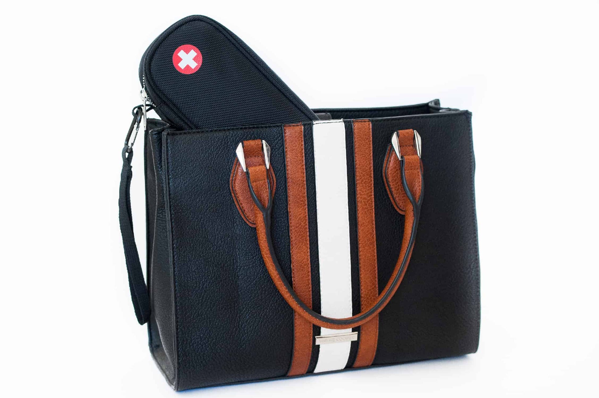PracMedic Bags black EpiPen case with red medical cross symbol placed inside a stylish black handbag with brown and white stripes, showing discreet medication storage
